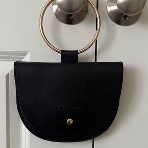 Melie Bianco Black Clutch with Gold Ring Accent